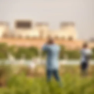Birdwatching at Ras Al Khor Birdwatchers observing flamingos in a tranquil natural setting
